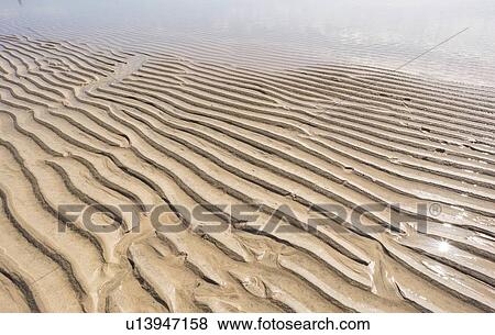 Stock Photo - Ripples on sand.. Fotosearch