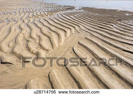 Stock Photograph - Ripples on sand.. Fotosearch