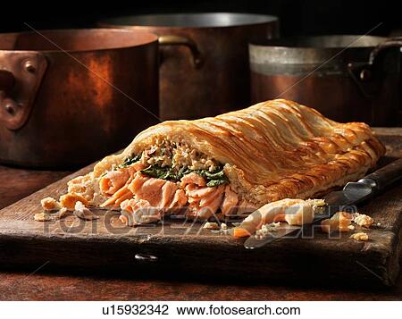 Stock Image - Salmon and prawn en croute. Fotosearch