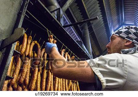 Picture - Sausages being smoked. Fotosearch