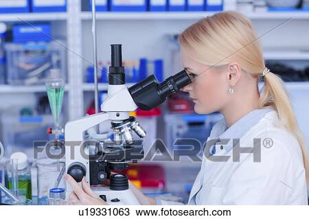 Scientist using microscope. View Large Photo Image Stock Image - Scientist using microscope.. Fotosearch