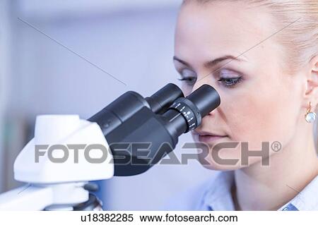 Scientist using microscope. View Large Photo Image Stock Photography - Scientist using microscope.. Fotosearch