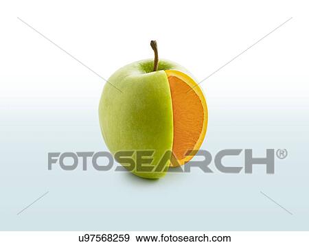 Segment cut from apple showing orange inside. View Large Photo Image Stock Photo - Segment cut from apple showing orange inside.. Fotosearch
