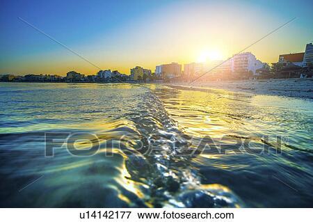 Shoreline at sunset. View Large Photo Image Stock Photo - Shoreline at sunset.. Fotosearch