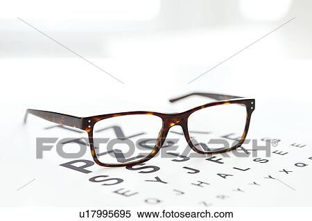 Stock Photography - Sight chart and spectacles.. Fotosearch
