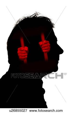 Stock Photo - Silhouette of man's head with person trapped behind bars, illustration.. Fotosearch