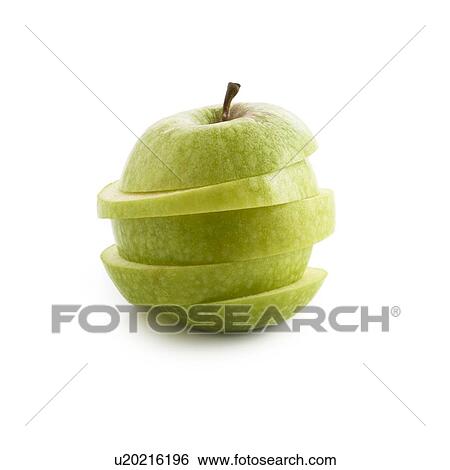 Stock Photograph - Sliced green apple against white background.. Fotosearch