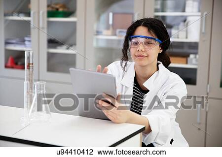 Student using digital tablet in laboratory View Large Photo Image Stock Image - Student using digital tablet in laboratory. Fotosearch