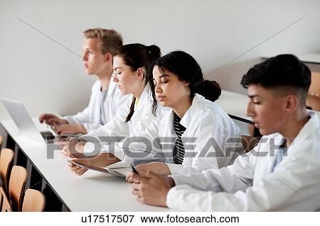 Stock Photo - Students at desk in science class. Fotosearch