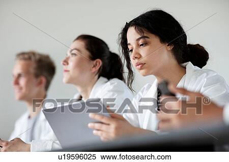 Stock Photography - Students at desk in science class. Fotosearch