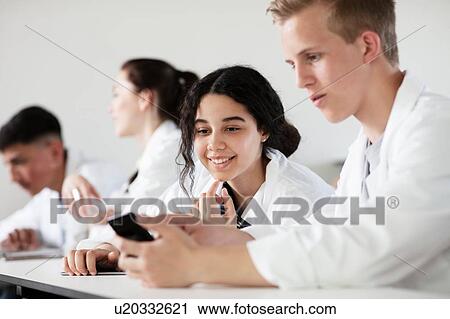 Students using cellphone in science class View Large Photo Image Stock Image - Students using cellphone in science class. Fotosearch