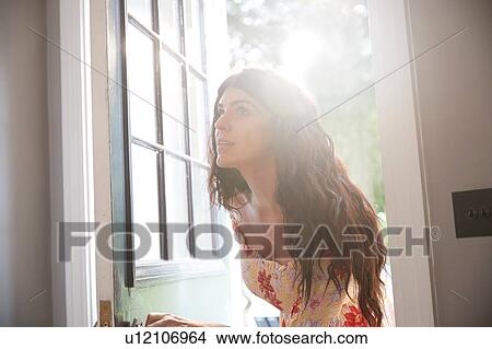 Stylish woman entering hotel doorway View Large Photo Image Picture - Stylish woman entering hotel doorway. Fotosearch