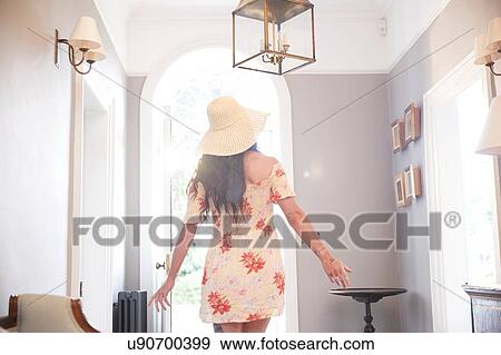 Stylish woman looking around hotel lobby, rear view View Large Photo Image Stock Photo - Stylish woman looking around hotel lobby, rear view. Fotosearch