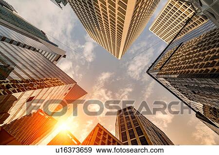 Stock Photo - Sunset on Hong Kong skyscraper skyline. Fotosearch
