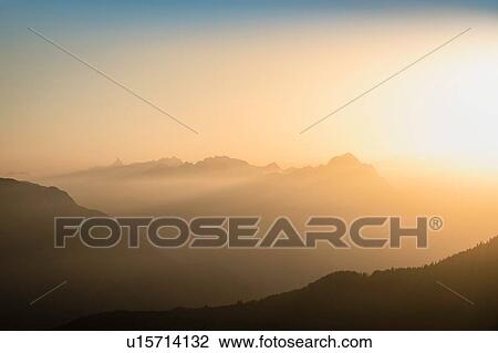 Stock Image - Sunset over French Alps, Parc naturel rgional du Massif des Bauges, Chatelard-en-Bauges, Rhone-Alpes, France. Fotosearch