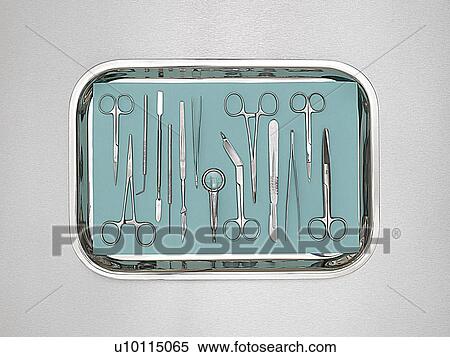 Stock Photography - Surgical equipment in a tray against a white background.. Fotosearch