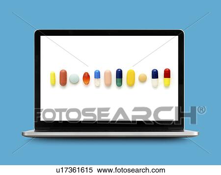 Stock Photography - Tablets on laptop monitor.. Fotosearch