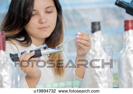 Testing wine in quality control lab. View Large Photo Image Stock Image - Testing wine in quality control lab.. Fotosearch