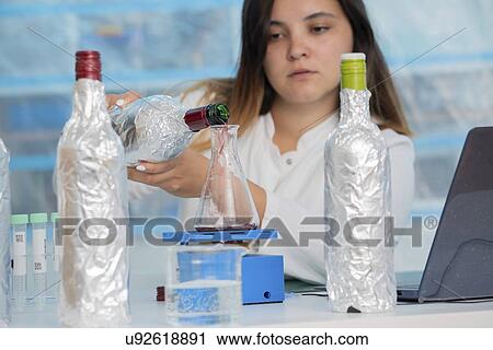 Stock Image - Testing wine in quality control lab.. Fotosearch