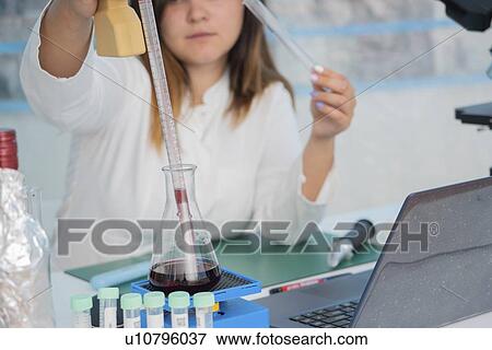 Testing wine in quality control lab. View Large Photo Image Stock Photo - Testing wine in quality control lab.. Fotosearch