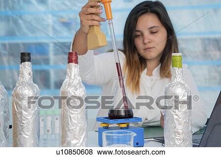 Testing wine in quality control lab. View Large Photo Image Stock Photo - Testing wine in quality control lab.. Fotosearch