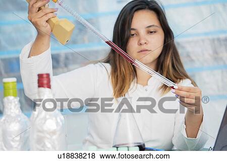 Testing wine in quality control lab. View Large Photo Image Stock Photo - Testing wine in quality control lab.. Fotosearch
