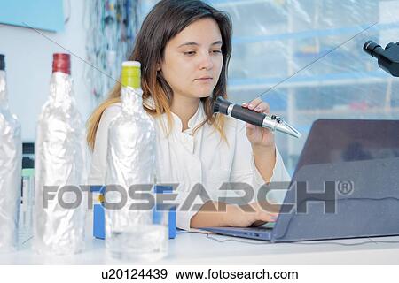Stock Photo - Testing wine in quality control lab.. Fotosearch