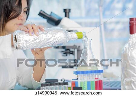 Stock Photography - Testing wine in quality control lab.. Fotosearch