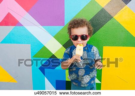 Toddler eating ice cream, mural in background, Wynwood, Miami, Florida, USA View Large Photo Image Stock Photography - Toddler eating ice cream, mural in background, Wynwood, Miami, Florida, USA. Fotosearch