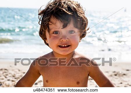 Toddler on beach View Large Photo Image Stock Image - Toddler on beach. Fotosearch
