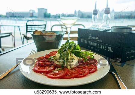 Tomato and Mozzarella salad and Ciabatta bread in cafe by River Danube, Budapest, Hungary View Large Photo Image Stock Photography - Tomato and Mozzarella salad and Ciabatta bread in cafe by River Danube, Budapest, Hungary. Fotosearch
