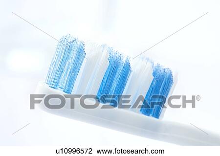 Stock Image - Toothbrush against a white background.. Fotosearch