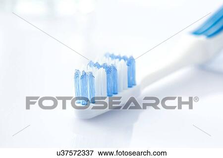 Toothbrush against a white background. View Large Photo Image Stock Photo - Toothbrush against a white background.. Fotosearch