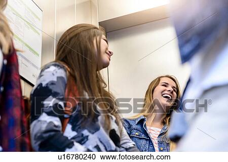 University students talking inside elevator View Large Photo Image Stock Image - University students talking inside elevator. Fotosearch
