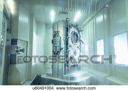 Picture - View of parts inside CNC machine in gearbox factory. Fotosearch