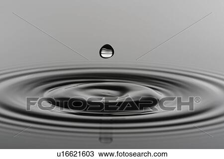 Stock Image - Water drop impact.. Fotosearch