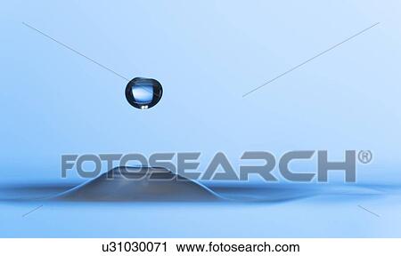 Stock Image - Water drop impact.. Fotosearch