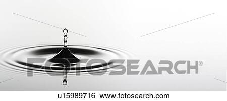 Stock Photograph - Water drop impact.. Fotosearch