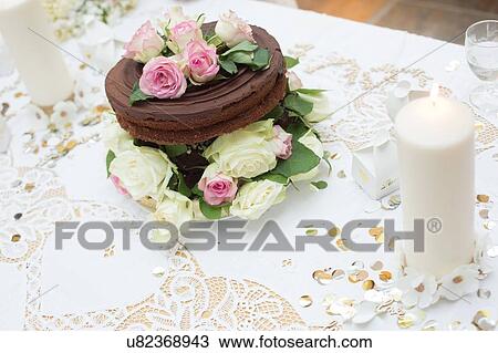 Wedding chocolate cake with floral decoration View Large Photo Image Stock Image - Wedding chocolate cake with floral decoration. Fotosearch