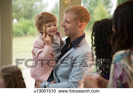 Stock Image - Wedding guests at reception. Fotosearch