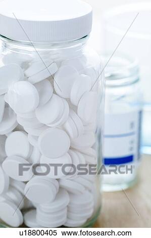 White pills in a glass bottle. View Large Photo Image Stock Photography - White pills in a glass bottle.. Fotosearch