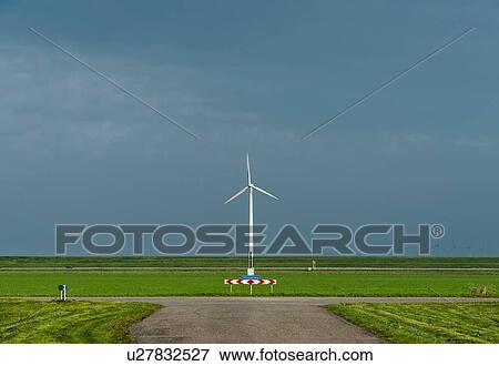 Stock Photo - Wind turbine on dyke, Flevopolder, Swifterbant, Flevoland, Netherlands. Fotosearch