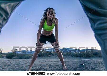 Woman and friend playing at camp area, Bishop, California, USA View Large Photo Image Stock Image - Woman and friend playing at camp area, Bishop, California, USA. Fotosearch