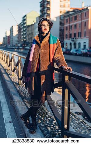 Woman by canal, Milan, Italy View Large Photo Image Stock Image - Woman by canal, Milan, Italy. Fotosearch