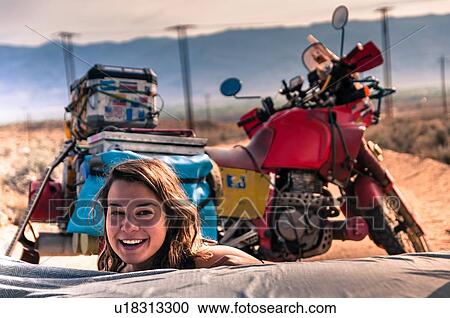 Stock Image - Woman camping, Bishop, California, USA. Fotosearch