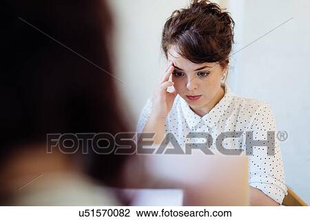Woman concentrating on work on laptop View Large Photo Image Stock Image - Woman concentrating on work on laptop. Fotosearch