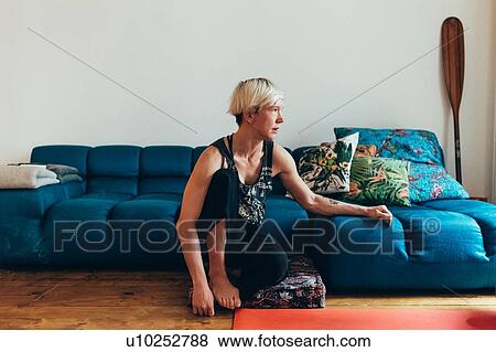 Woman daydreaming at home View Large Photo Image Stock Photo - Woman daydreaming at home. Fotosearch