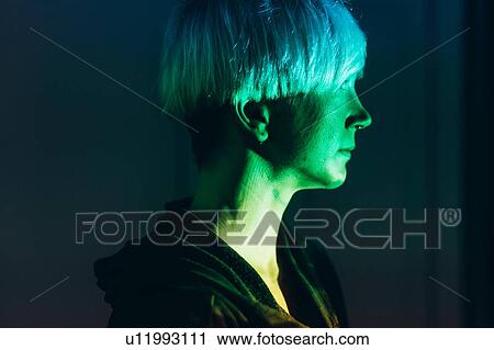 Woman daydreaming, green light reflected on face View Large Photo Image Stock Image - Woman daydreaming, green light reflected on face. Fotosearch