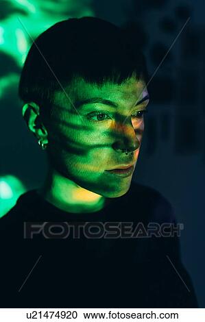 Woman daydreaming, green light reflected on face View Large Photo Image Stock Image - Woman daydreaming, green light reflected on face. Fotosearch
