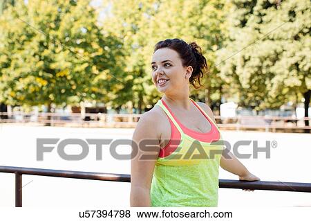 Woman exercising in park View Large Photo Image Stock Photo - Woman exercising in park. Fotosearch